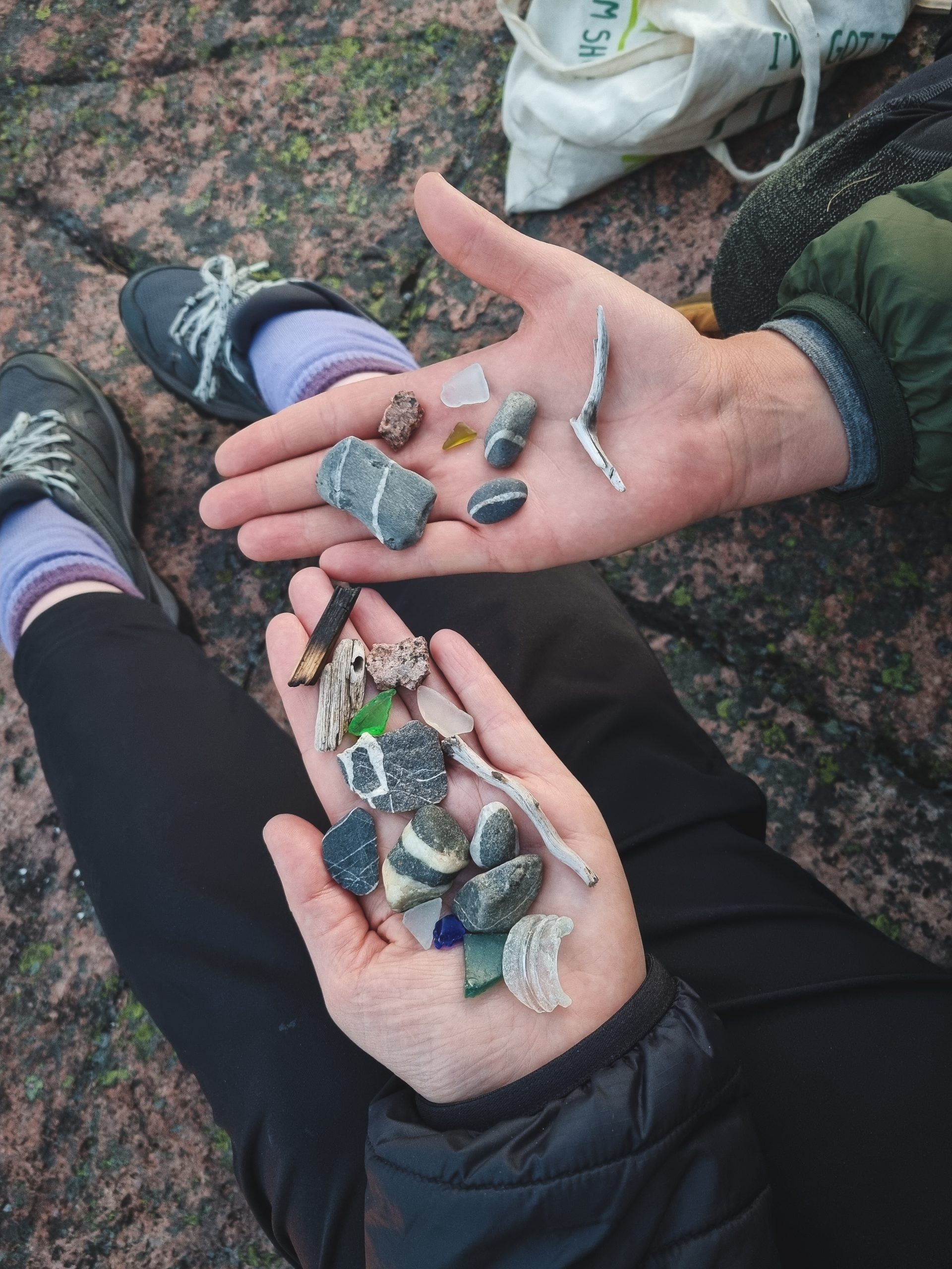 Rocks and sticks in hands