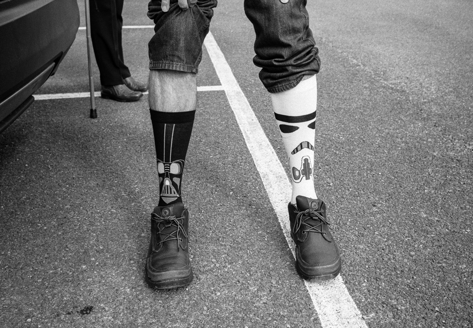 Pulled up trousers showing socks