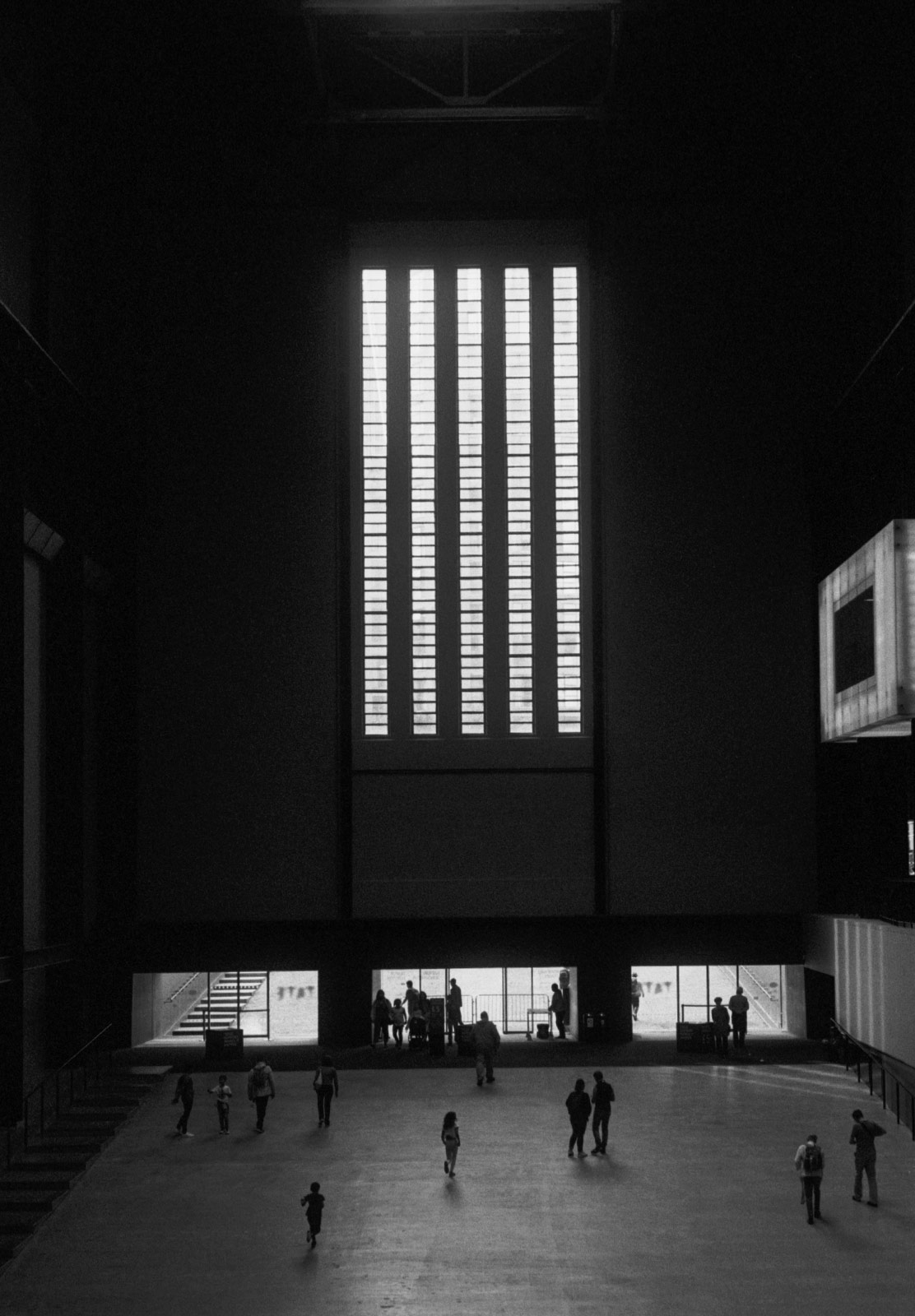 People walking across hall