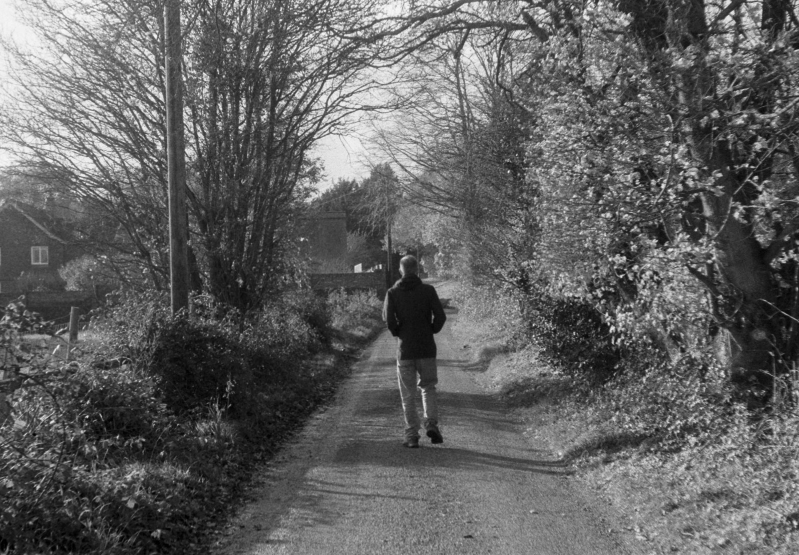 Man walking down lane