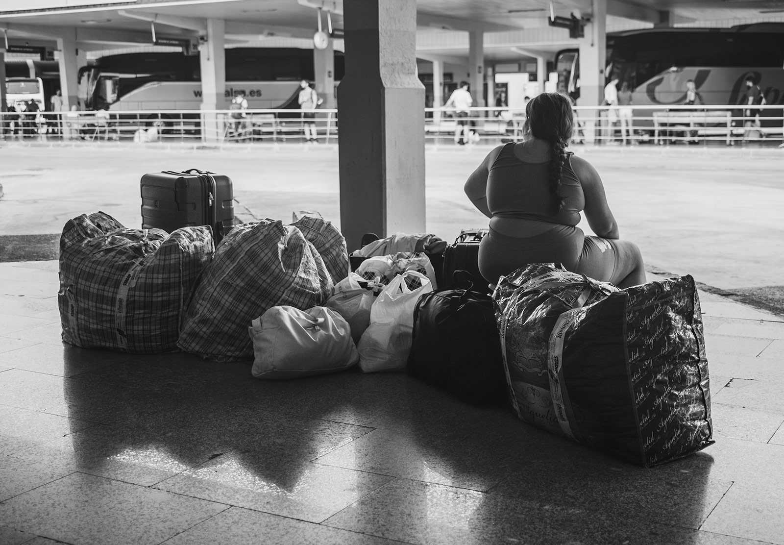Girl sitting on packed bags