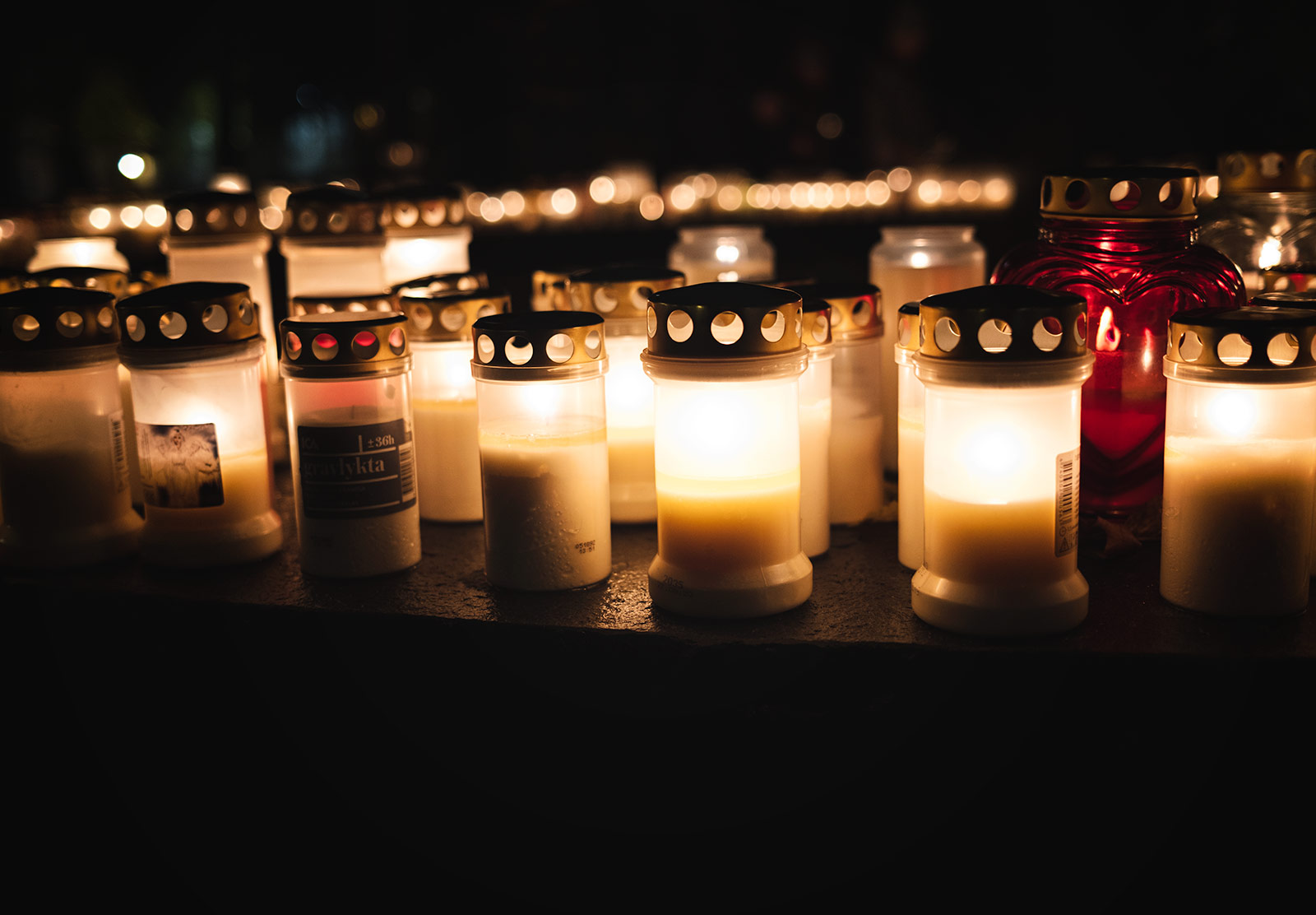 Row of candles in jars