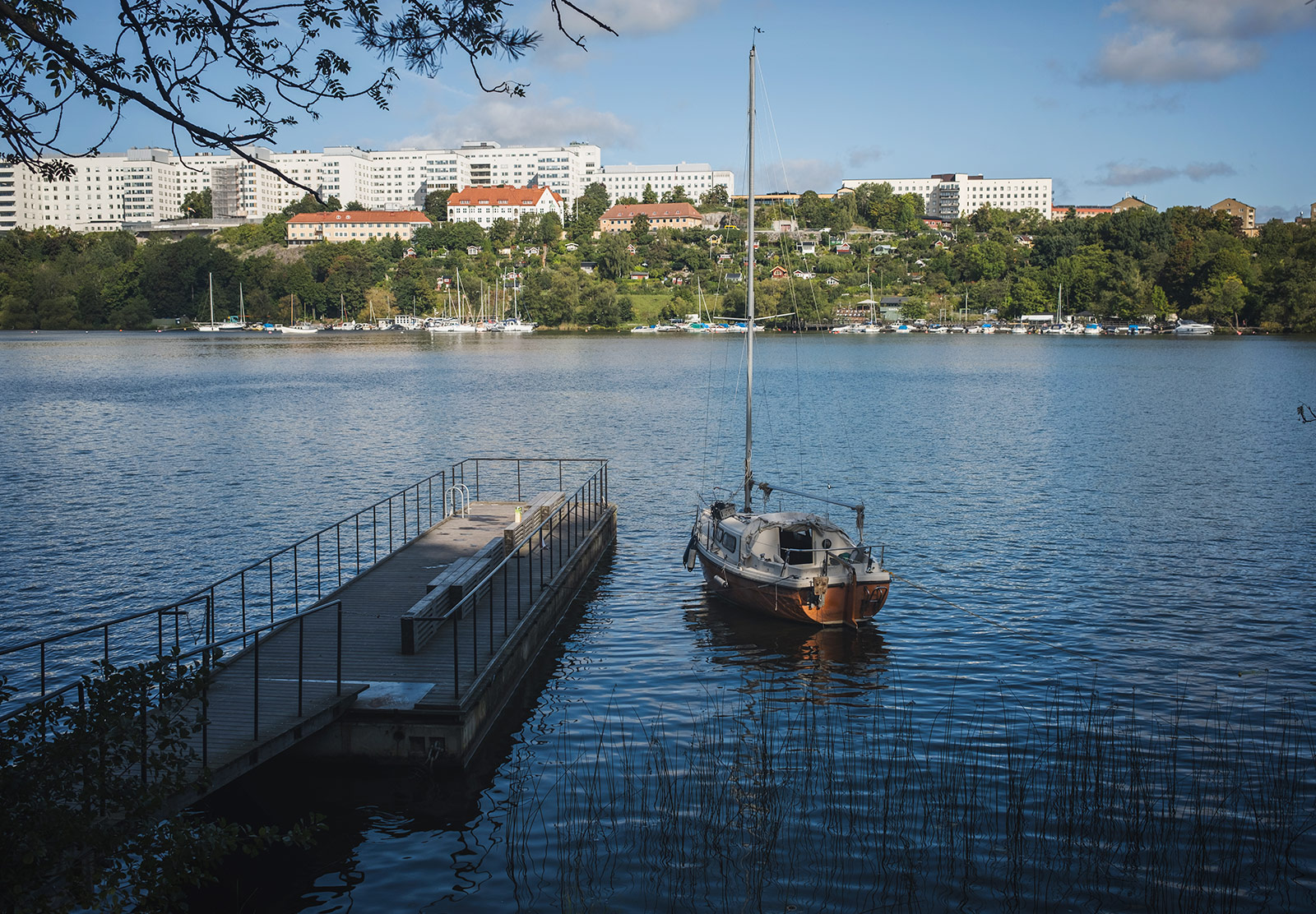 Boat moored next to a city jetty