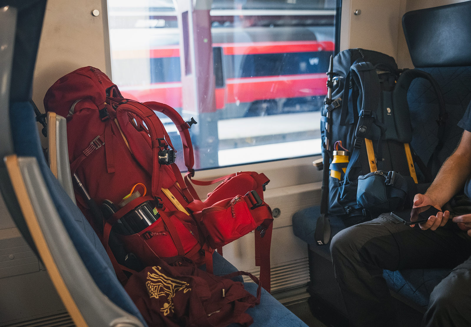 Large backpacks on train seats