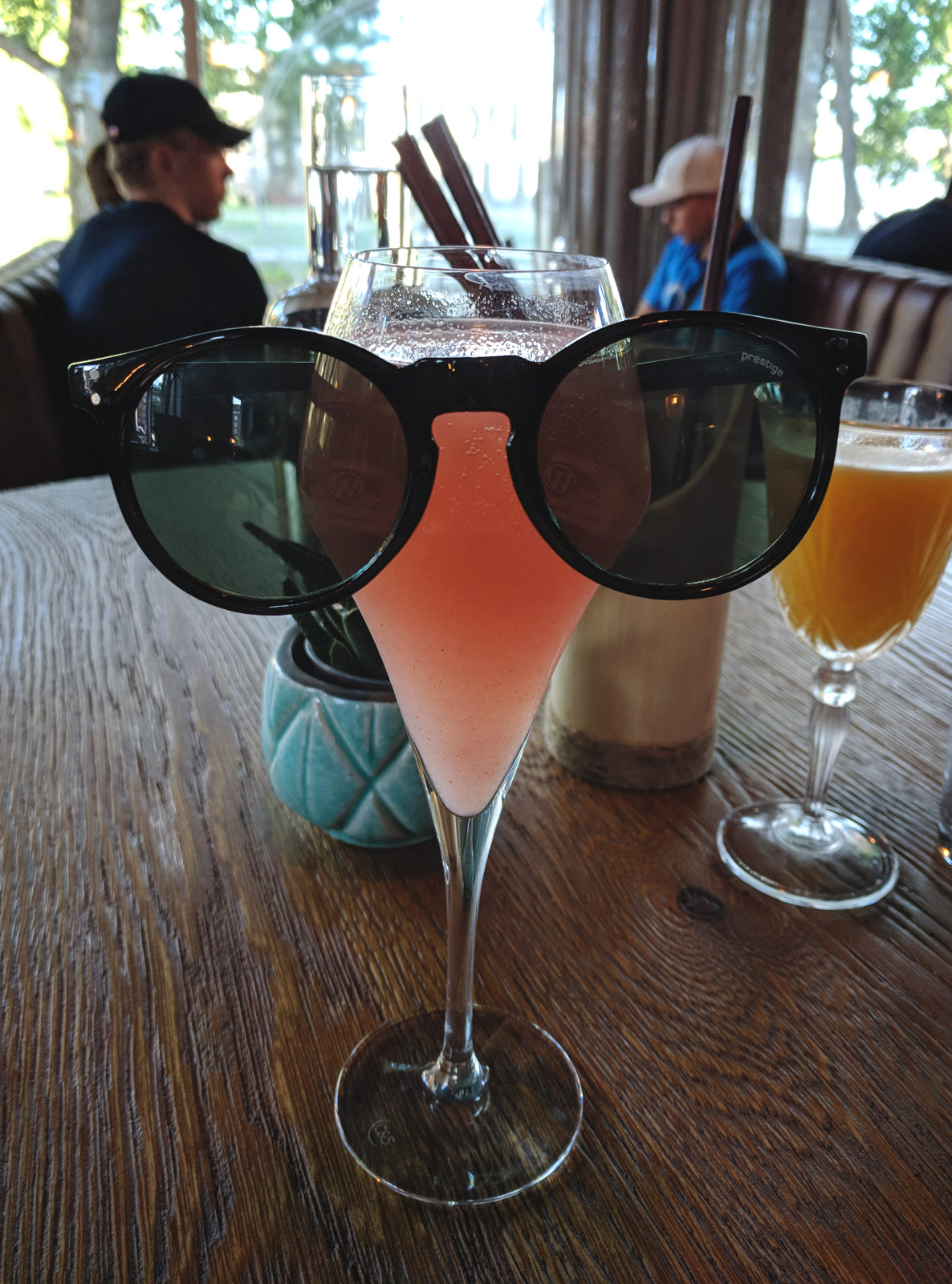 Sunglasses on peach bellini