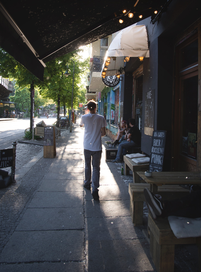 Man walking along pavement
