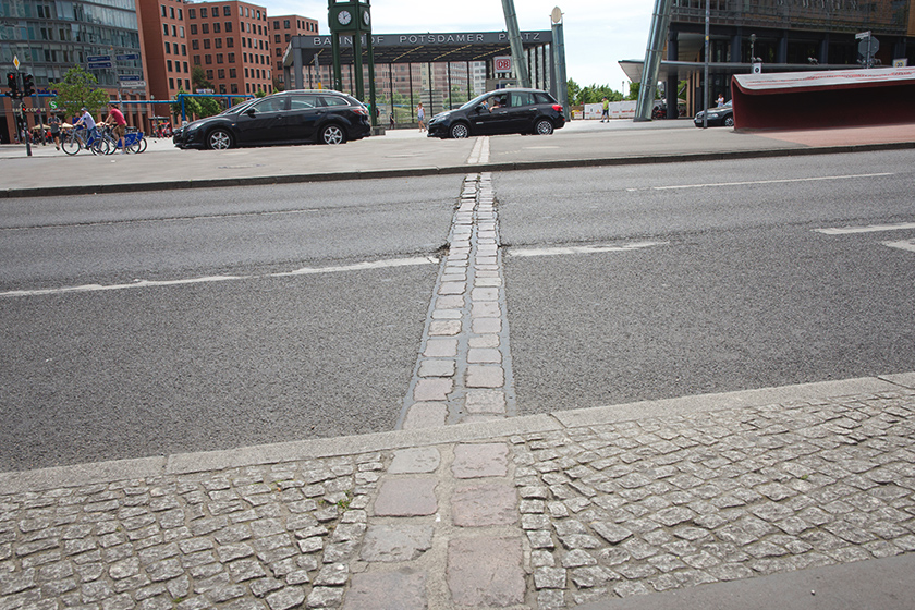 Berlin wall cutting through road