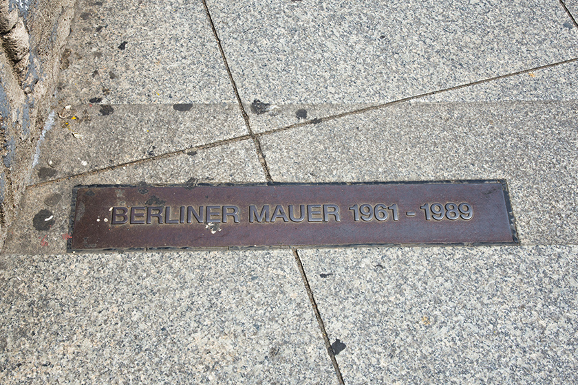 Metal plaque in paving