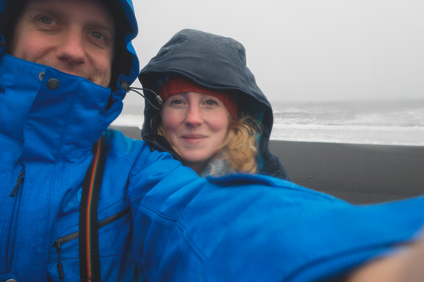 Us on on a black sand beach