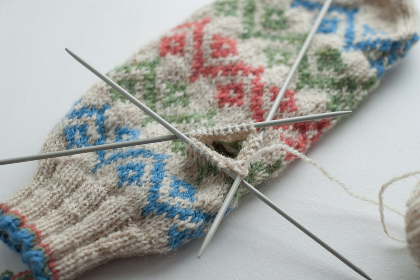 Thumb stitching forming a tube