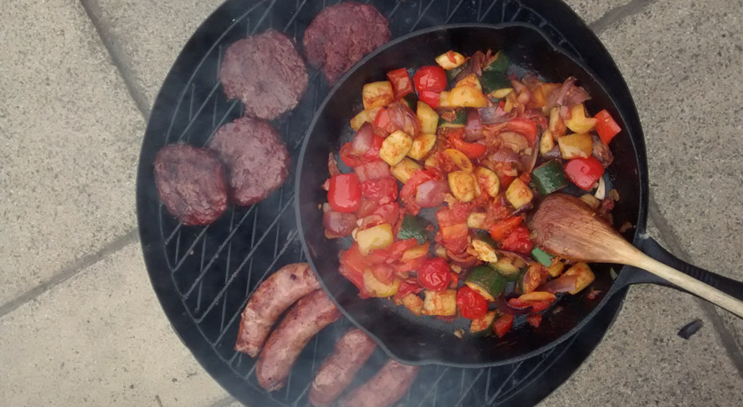 Skillet and meat on BBQ