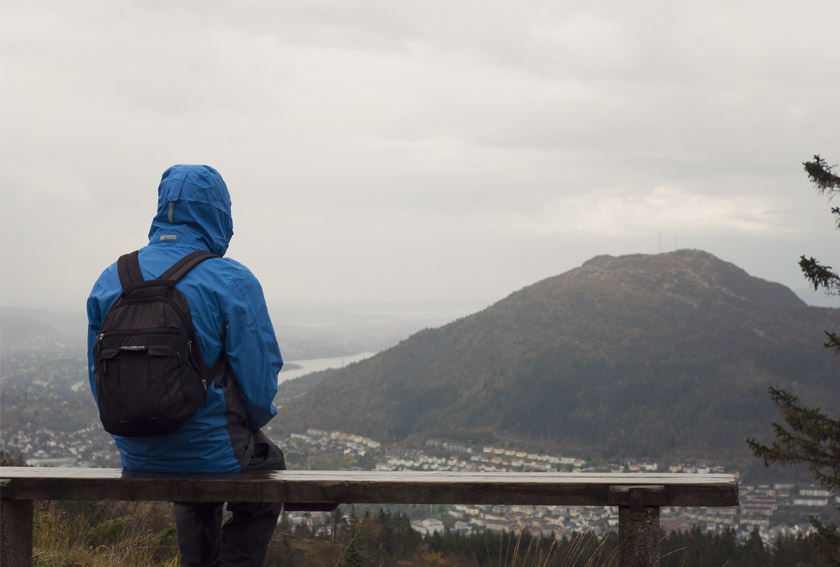 Man overlooking Bergen from mountaintop