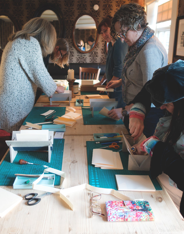 Bookbinding group at table