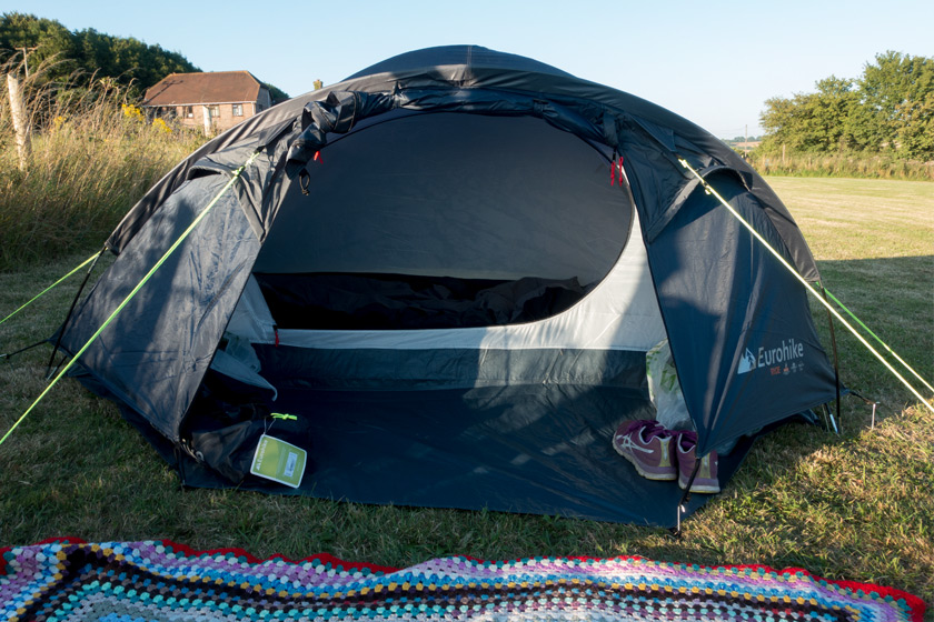 Pitched tent in field