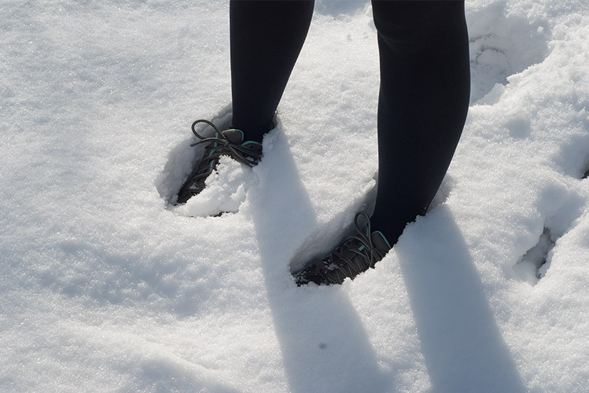 Feet ankle deep in the snow