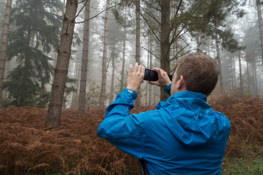 Man with camera in the fog