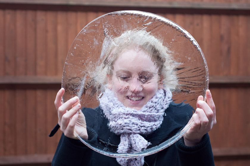 Holding up a big piece of ice