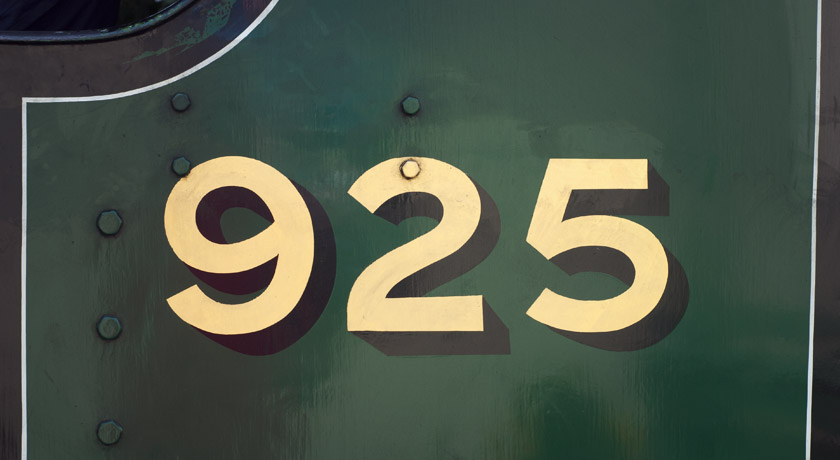 Gold letters on green train