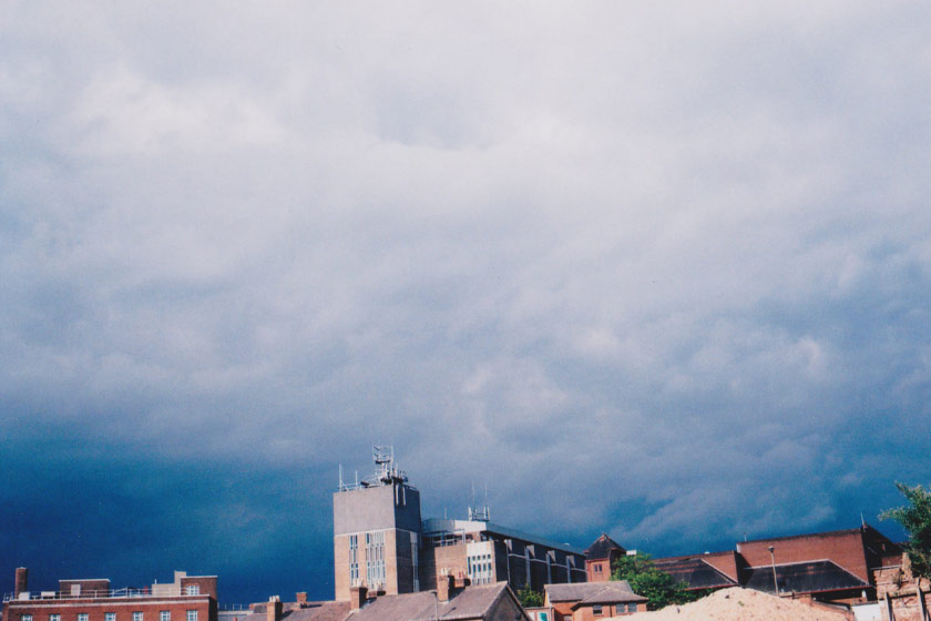 Dark moody skies over city