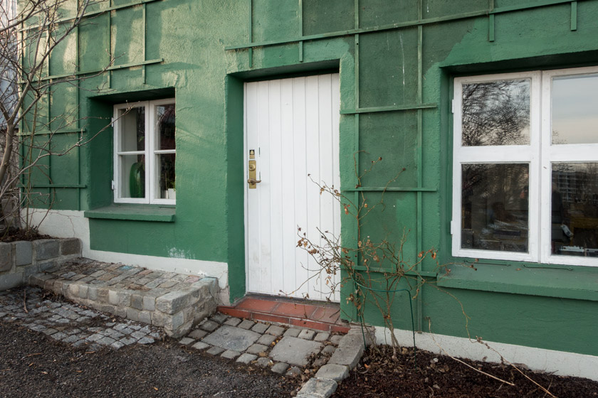 Green house with white windows