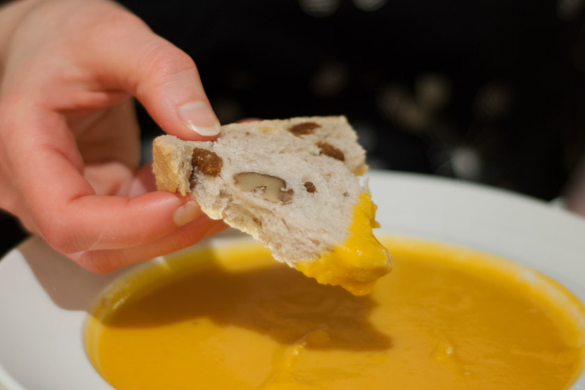 Bowl of soup with walnut bread