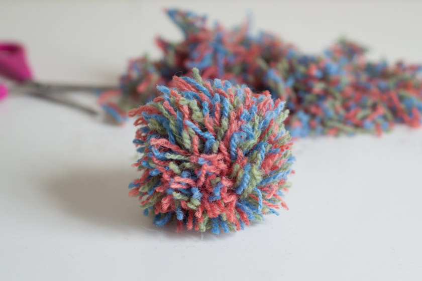 Pompom with wool in background