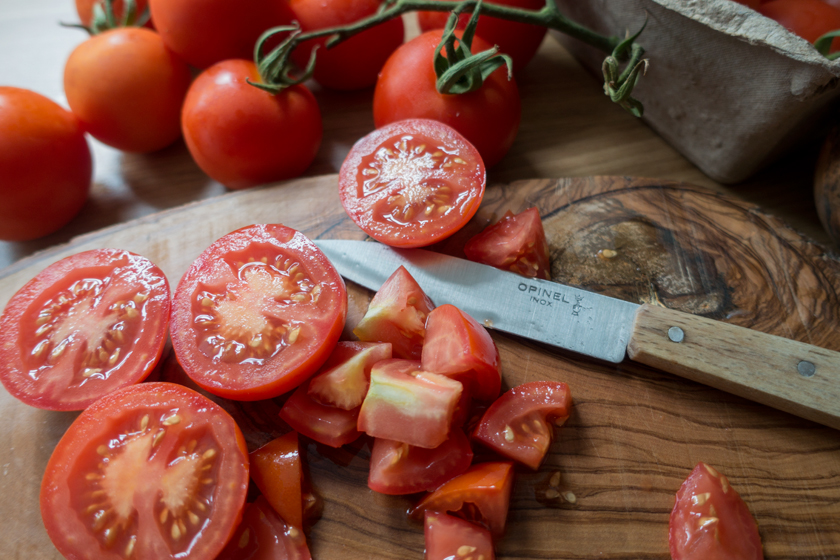 Tomatoes on chopping board