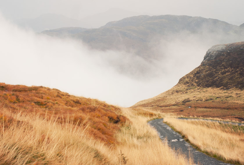Clouds rolling over mountain