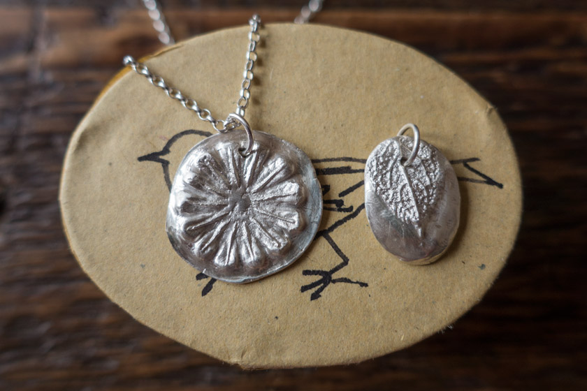 Silver pendant on box
