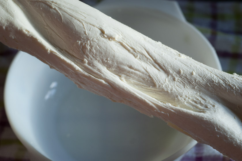 Mozzarella being hand stretched