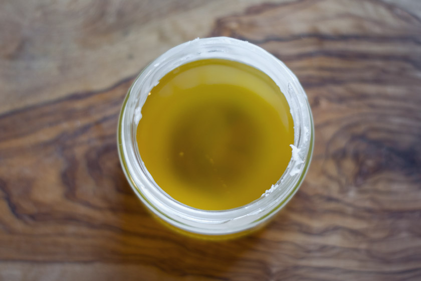 Jar of melted oil and wax