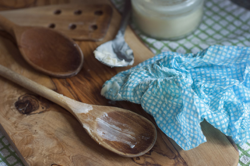 Spoons and wood butter on board