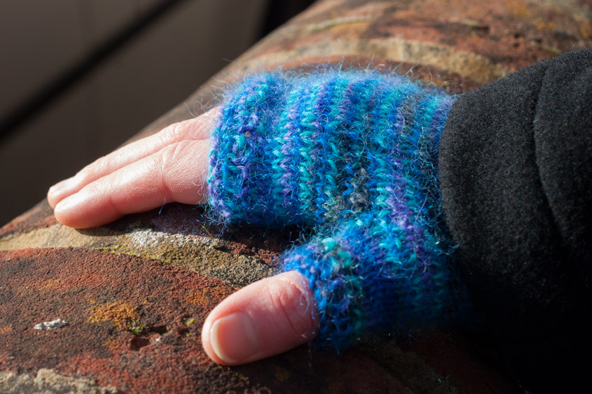 Blue knitted fingerless glove
