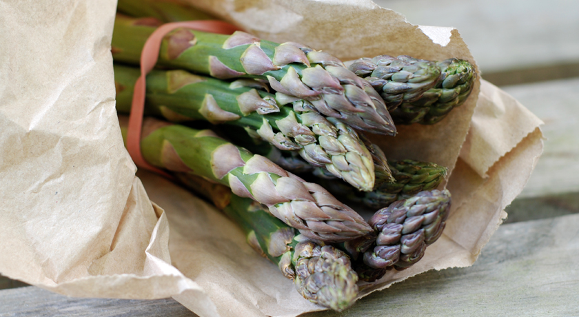 Fresh asparagus in a paper bag