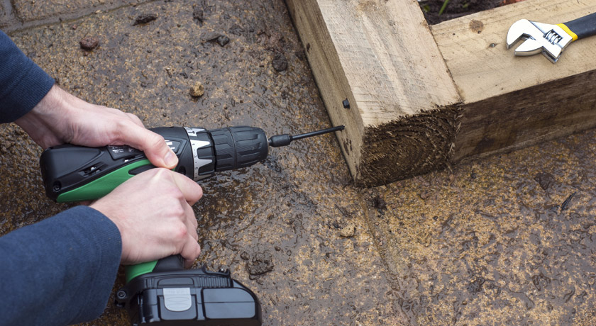 Screwing the raised beds into place