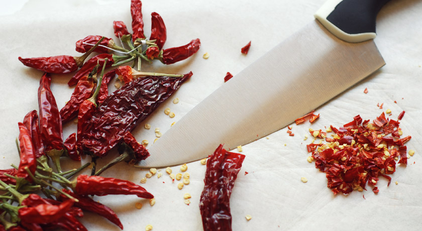 Dried chillies on chopping board