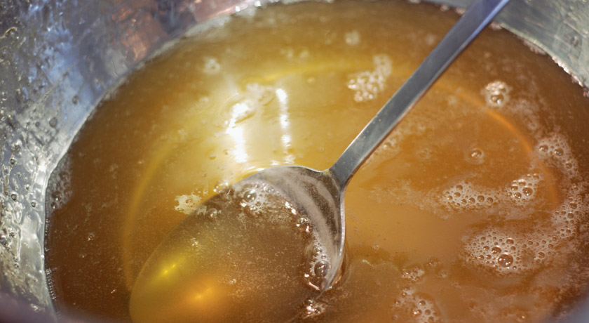 Elderflower jam cooking in jam pan