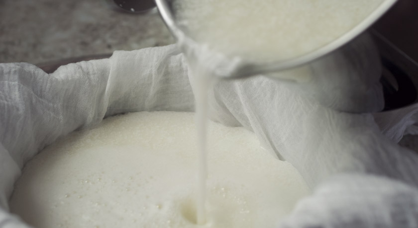 Goats cheese poured into muslin