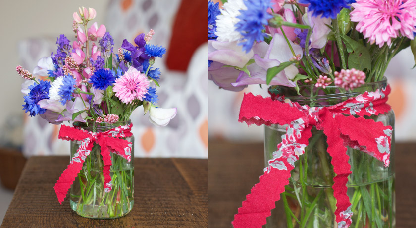 Jam jar posie of wild flowers