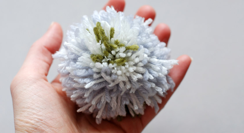 Grey and green wool pompom