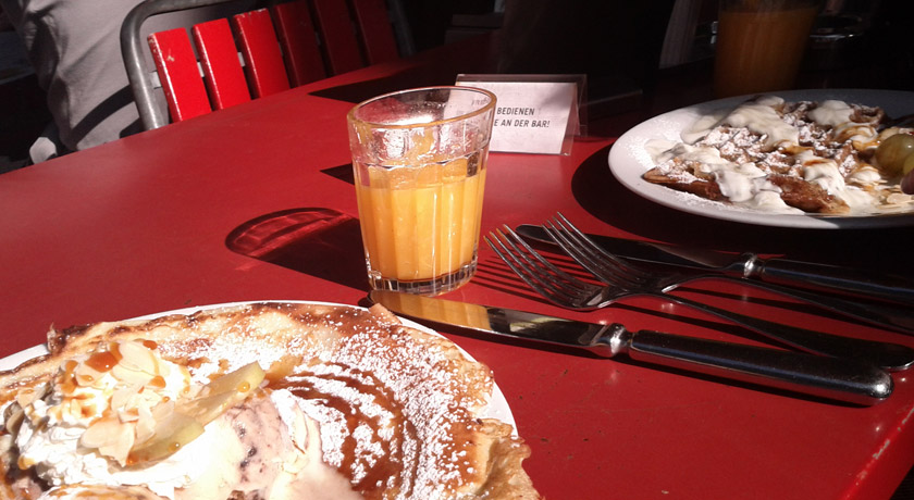 Breakfast pancakes and waffles on a table