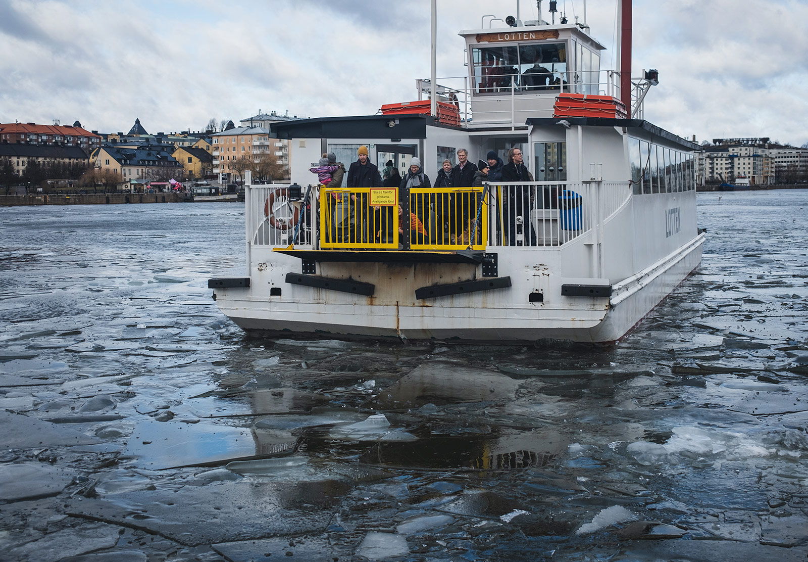 Passenger boat pushing through ice