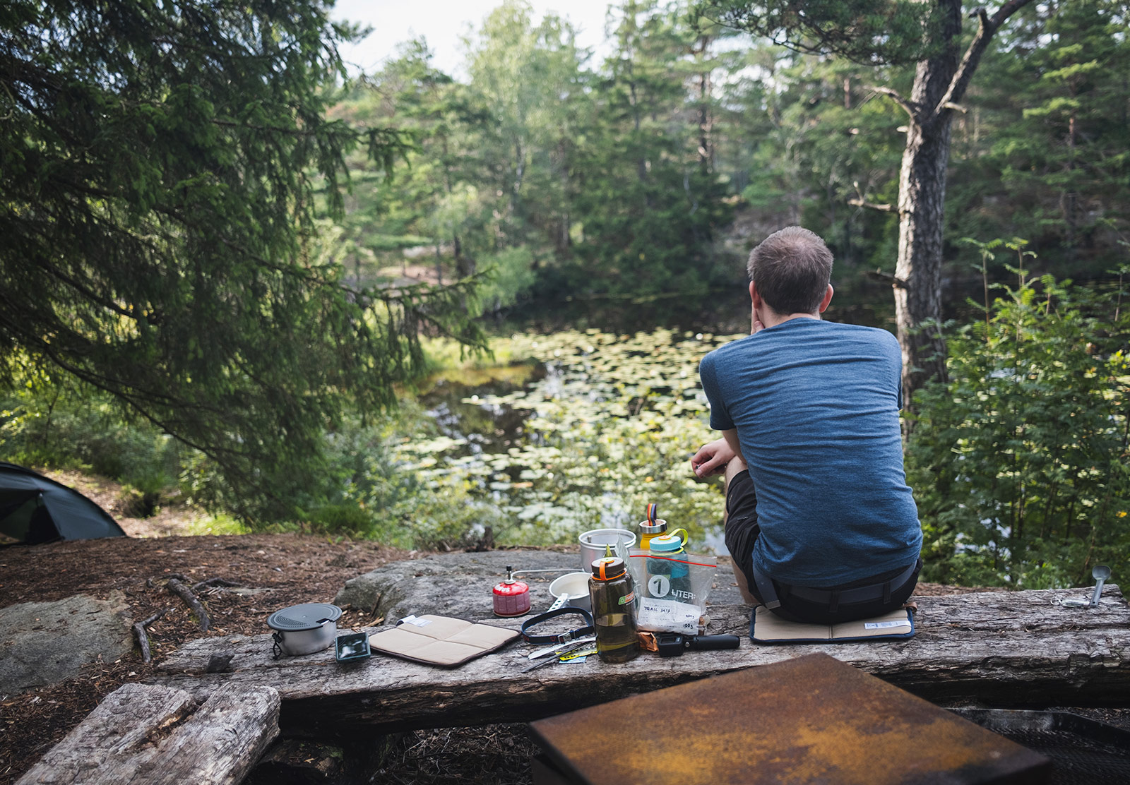 Man sat looking out over lake