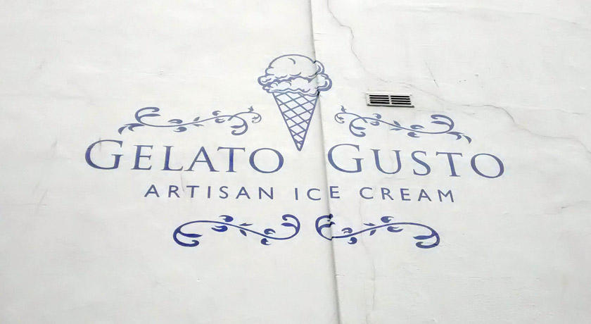 Gelato Gusto sign painted on wall