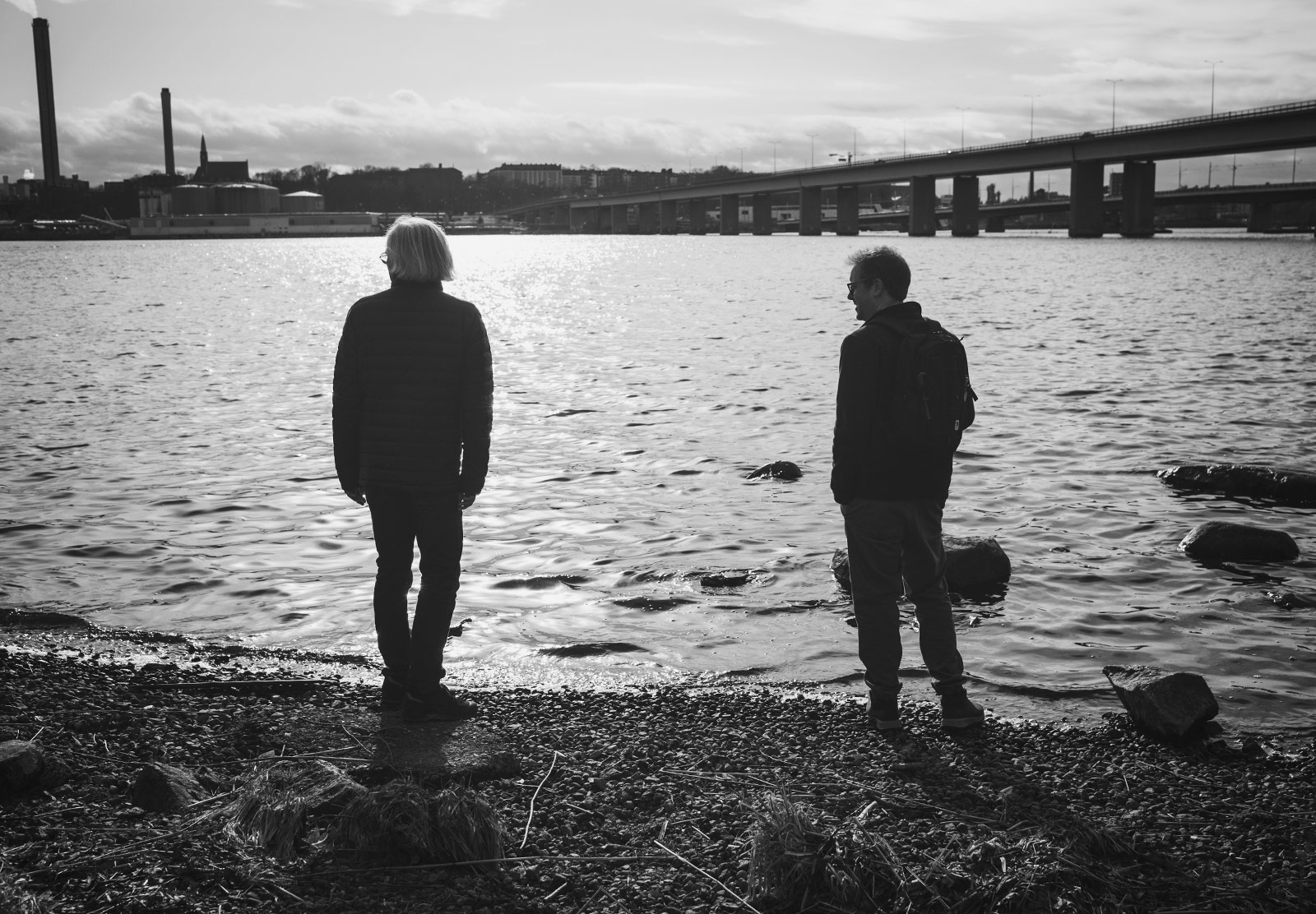 Two men stood on shore