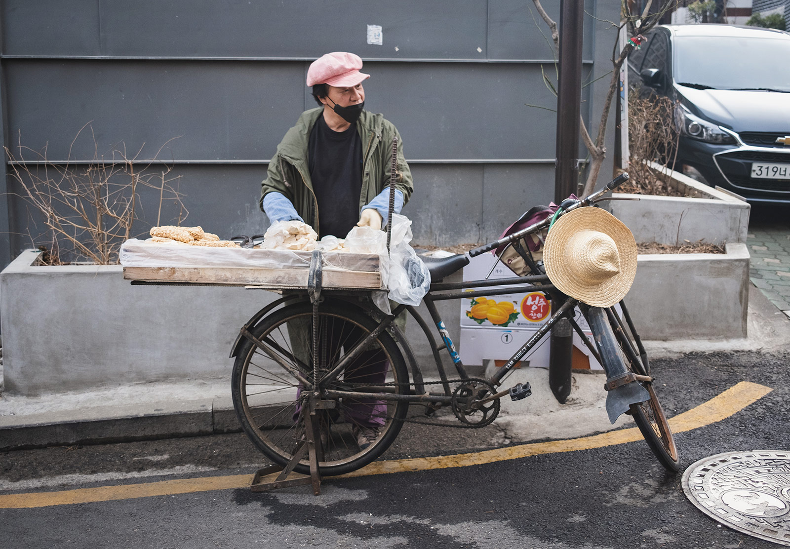 Man selling food from bike basket