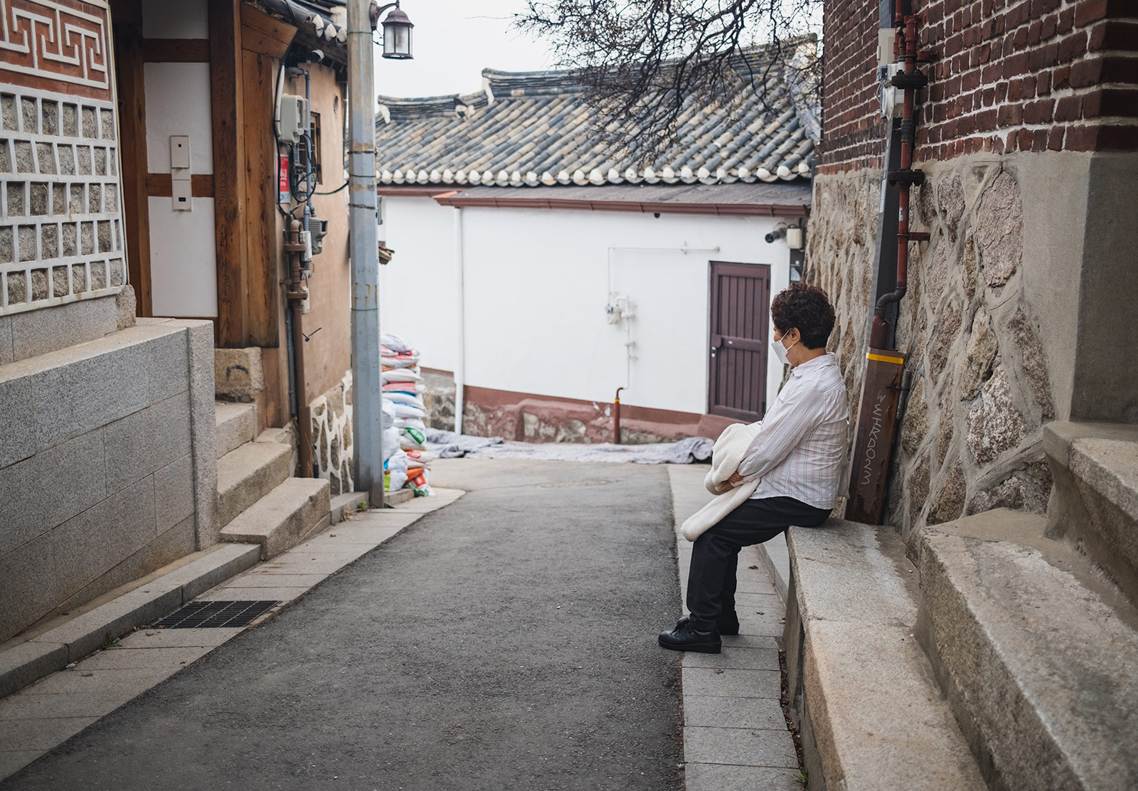 Woman sitting quietly on a step