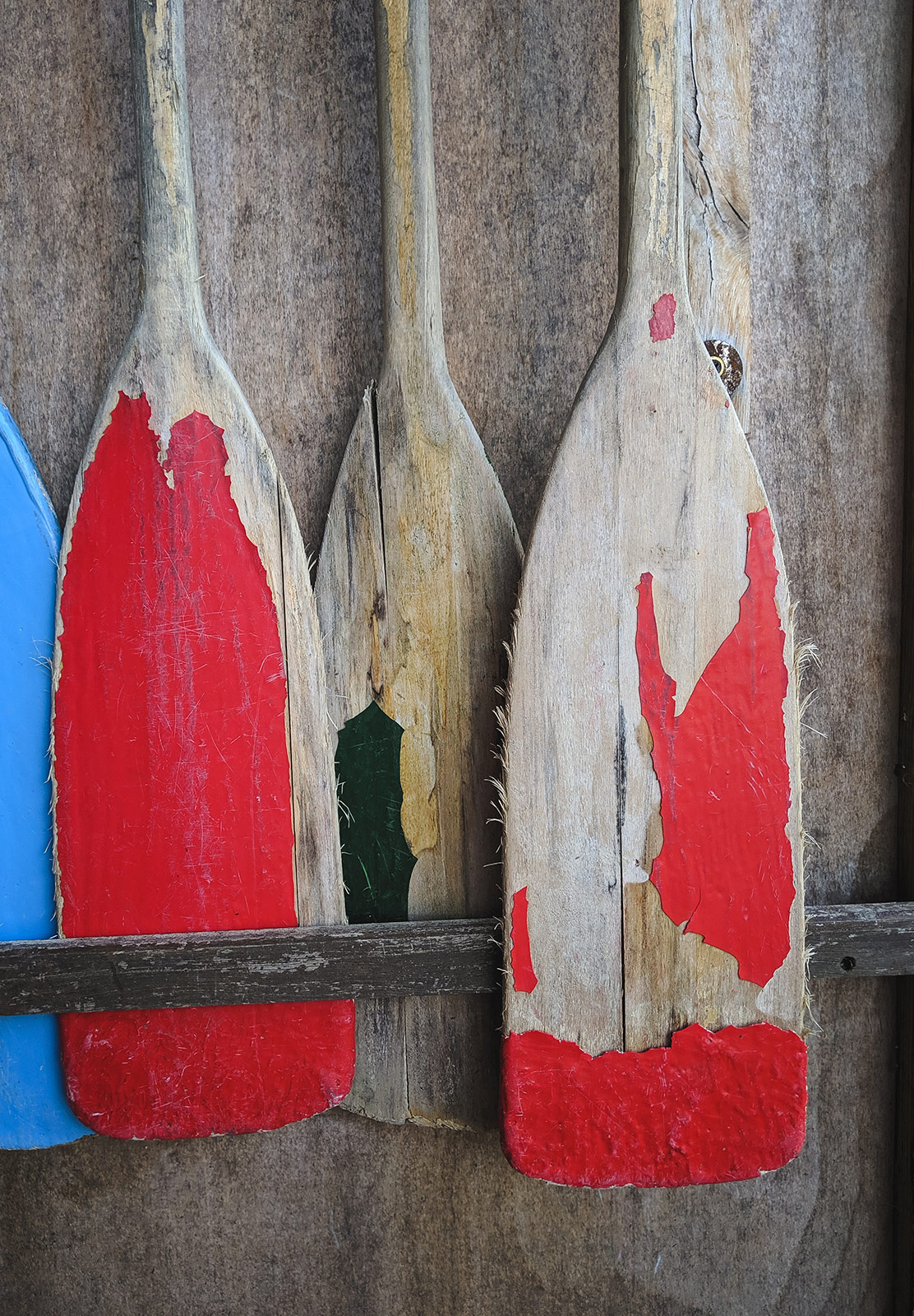 Old painted wooden paddles