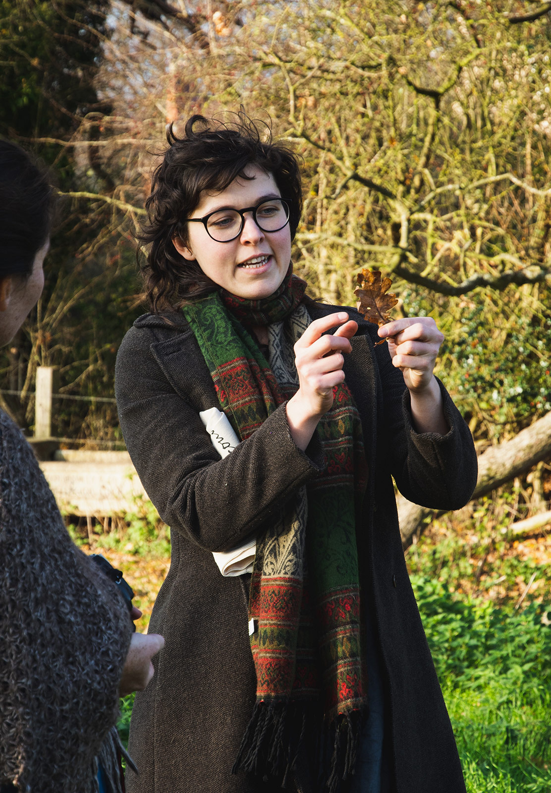 Woman holding leaf