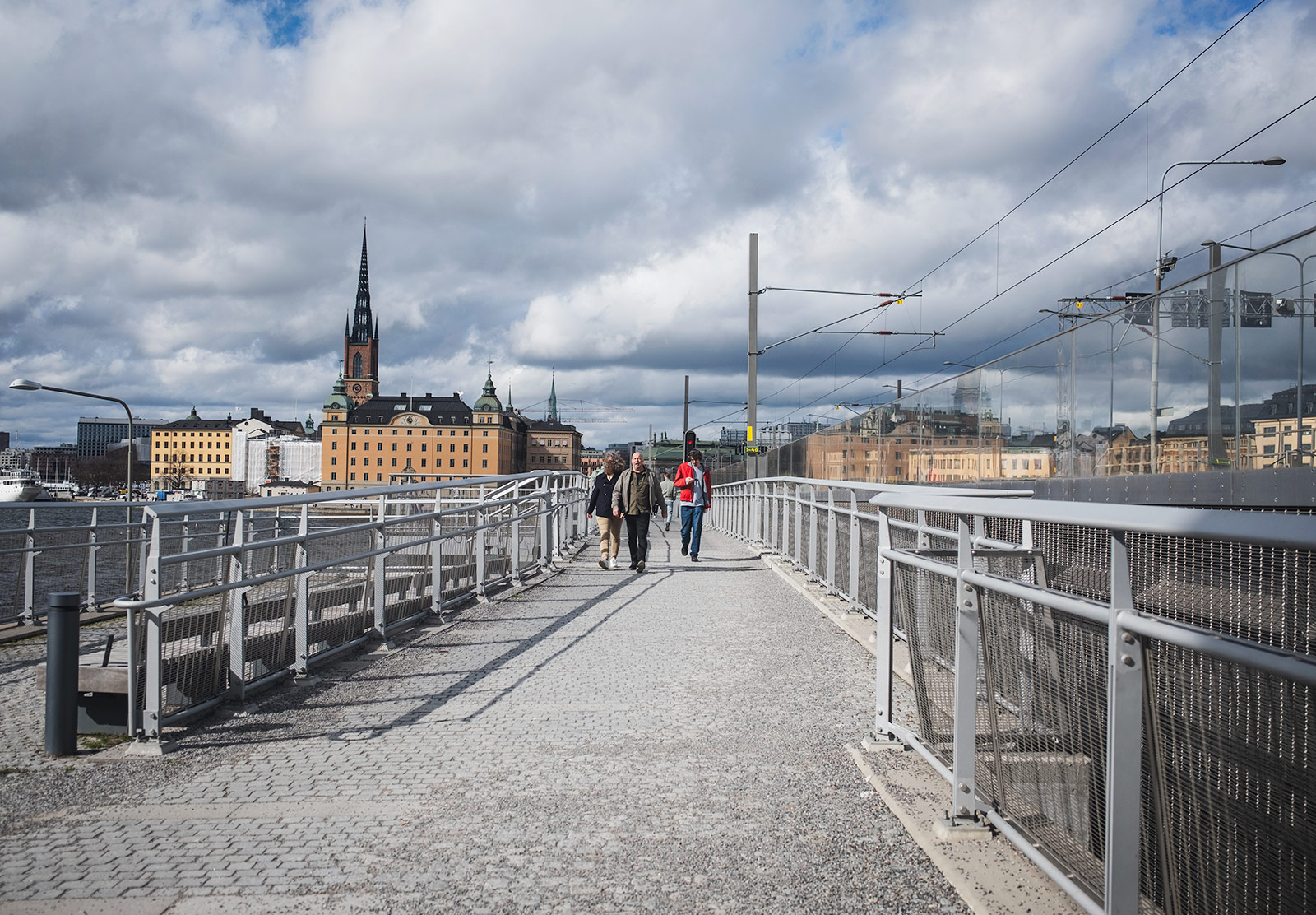 People walking over bridge